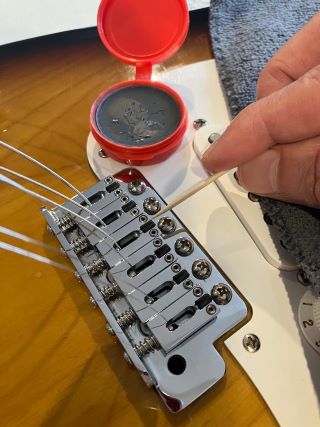 5 handy tools for re-stringing a guitar